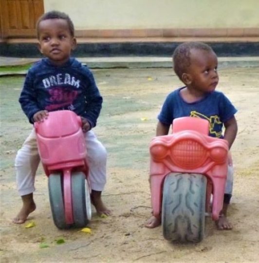 Little boys on toy bikes