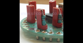 small vertical resistor or diode supports