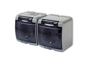 JUNIOR IP54 Gniazdo podwójne z uziemieniem schuko (klapka dymna: bez przesłon) popielaty 10GHE-2sd KARLIK