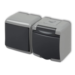 JUNIOR Łącznik jednobiegunowy z gniazdem hermetycznym (klapka grafitowa) popielaty / grafitowy 30WGHH-1