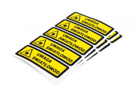 Naklejka 25x100mm z trójkątem ostrzegawczym i napisem Uwaga światłowód,20 szt.(4 arkusze po 5szt) SP-NKL-US