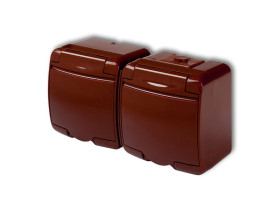 JUNIOR IP54 Gniazdo podwójne z uziemieniem schuko (klapka brązowa: przesłony torów prądowych) brązowy 4GHE-2sp KARLIK