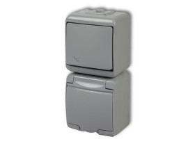 JUNIOR IP54 Wyłącznik schodowy z gniazdem pojedynczym z uziemieniem (klapka popielata: przesłony torów prądowych) popielaty0WGHP