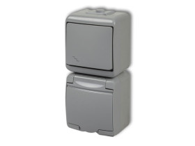 JUNIOR IP54 Wyłącznik schodowy z gniazdem pojedynczym z uziemieniem (klapka popielata: bez przesłon) popielaty0WGHP-3 KARLIK