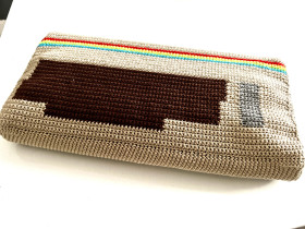 Handmade crocheted cover for C64 breadbin