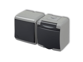 JUNIOR IP54 Wyłącznik schodowy z gniazdem pojedynczym z uziemieniem (klapka grafitowa: bez przesłon) popielaty / grafitowy 30WGH