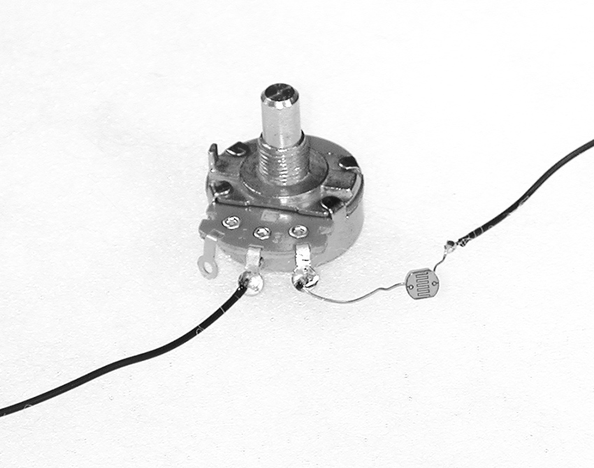 A potentiometer and photoresistor in series