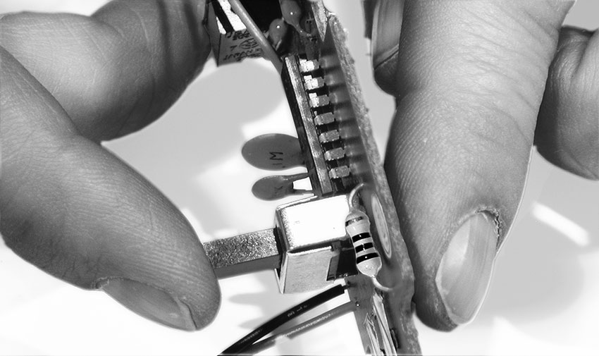 Finding the clock resistor (ﬁnger on right)