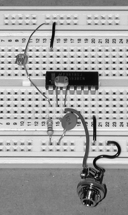 Photoresistor-gated oscillator with photoresistor-controlled frequency