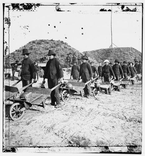Sherman's troops carrying away ammunition from the recently-fallen Confederate stronghold in Savannah, Fort McAllister