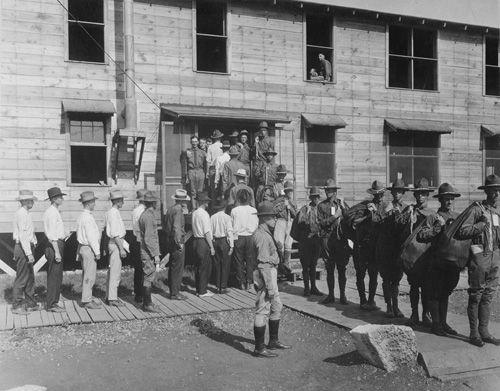 Men entered as civilians and exited in Army uniforms at Camp Travis, San Antonio, Texas