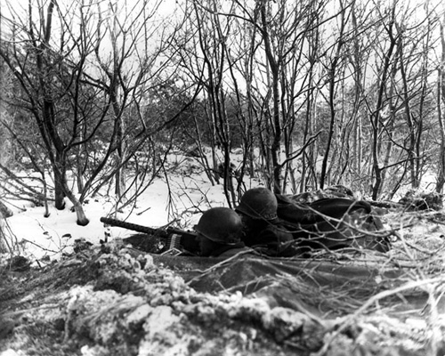GIs from the 45th Infantry Division set up a road block
