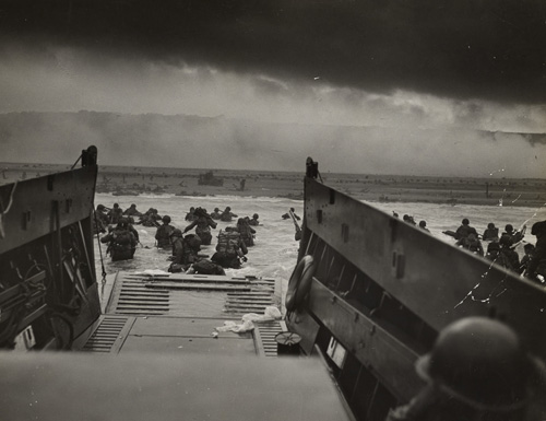 GIs from the 16th Infantry, 1st Infantry Division are offloaded onto Omaha Beach in the face of withering German fire