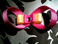 pink bow with pink and yellow ribbon and clear gem