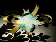 yellow bow with green ribbon and white polka dots