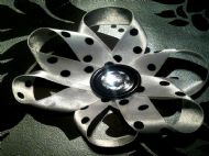 white bow with black polka dots and clear gem on black centre