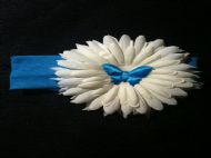 blue hairband with large white flower and blue butterfly