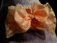 orange/yellow hairband with lace bow