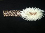 leopard print hairband with white flower and gold butterfly