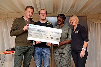 maria njamba with pdc donation cheque