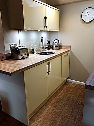 Kitchen with new countertop, electric kettle, toaster and on demand hot water
