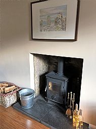 Superb log burner and art by Maryjory Tait