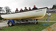 5 men in a boat