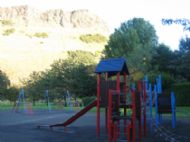 Play area beneath Salisbury Crags in nearby Holyrood park.
