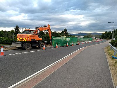 widening the approach road to the overbridge