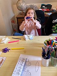 Helping Joshua by blowing a trumpet.