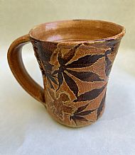 Coffee mug with leaves and flowers