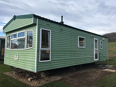 outside of the caravan, doors side