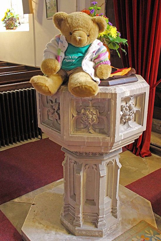 big ted sitting on font