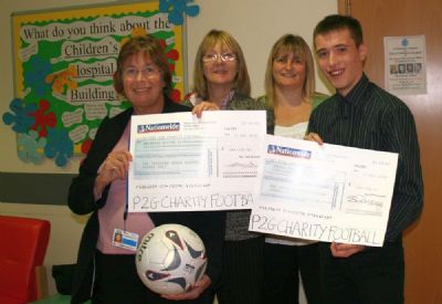 andrew (right) and maxine (second left) presenting chox & abingdon boxing club with &pound;1,700 each