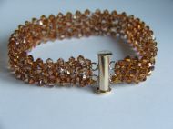 THIN HAND WOVEN CUFF WITH 3MM SWAROVSKI CRYSTAL BICONES AND GOLD SLIDING CLASP