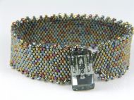 METAL EFFECT HAND WOVEN CUFF WITH SWAROVSKI CRYSTAL BUTTON CLASP