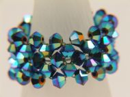 3MM BICONE WOVEN RING IN PEACOCK
