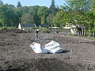 Digging and manual clearing proceeds
