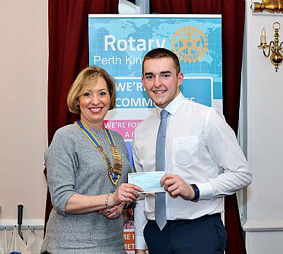 ben is seen here last year being presented with his sponsorship cheque from gillian marsh as president.