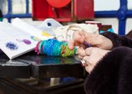 Suesie Smith making knitted wool beads