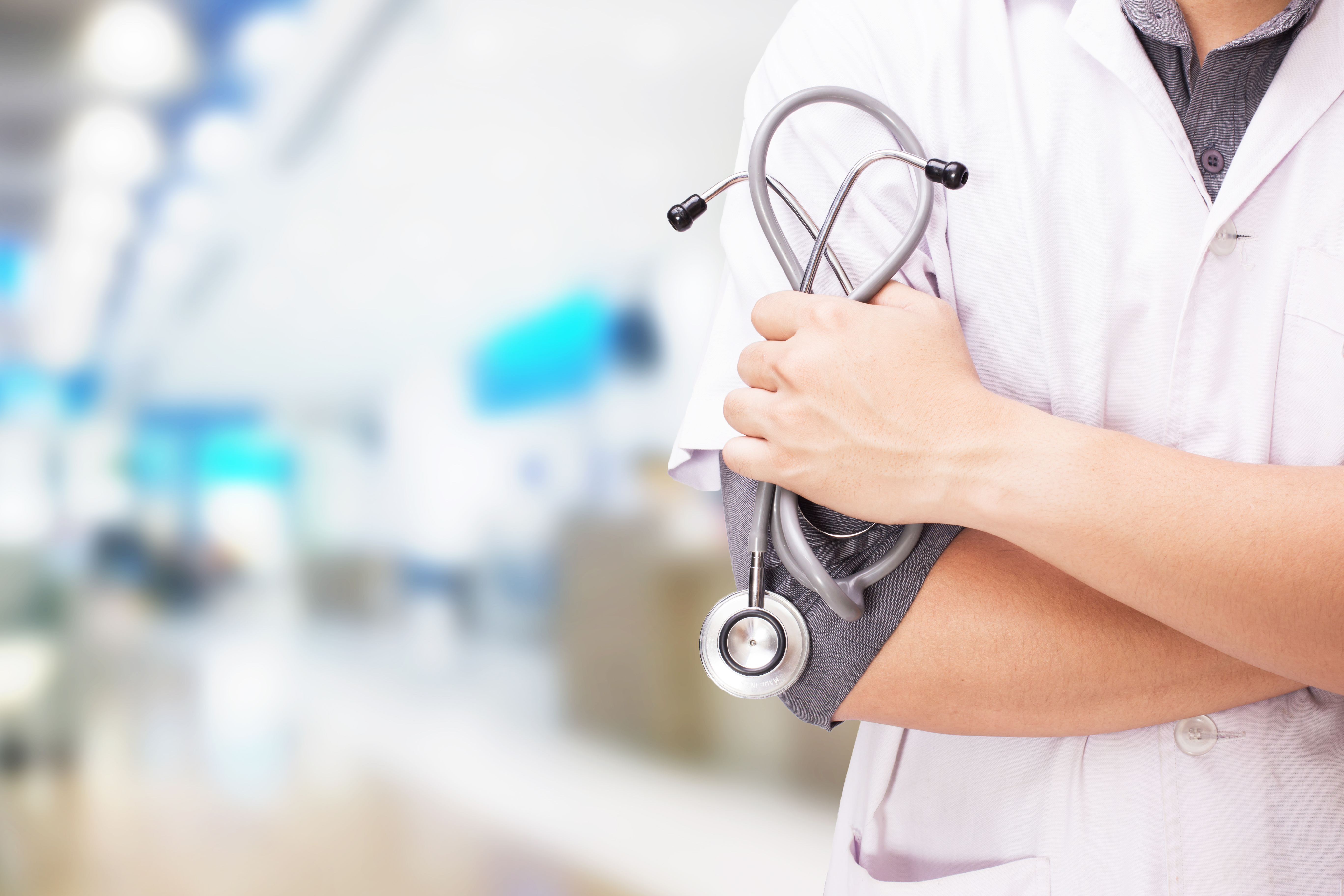 Doctor In Hospital With Stethoscope On White Doctor With A Stethoscope In The And Hospital