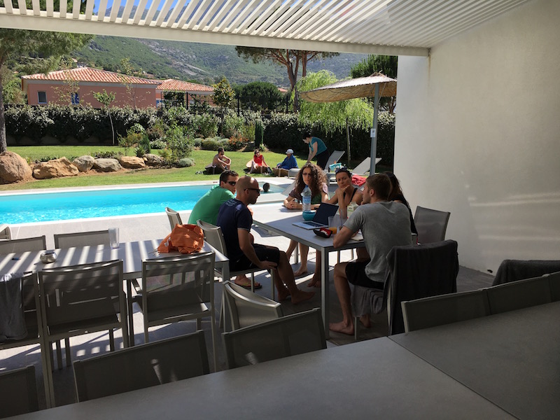 The team chilling by the pool in one of the villas
