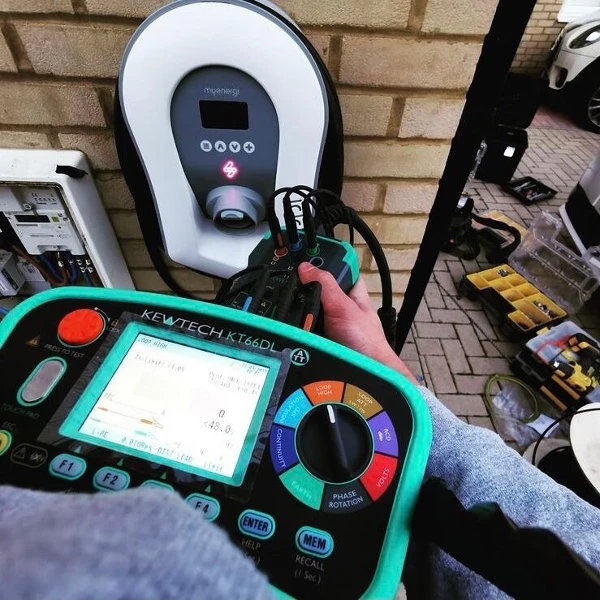 Engineer holding the Kewtech KT66ET in gloved hands