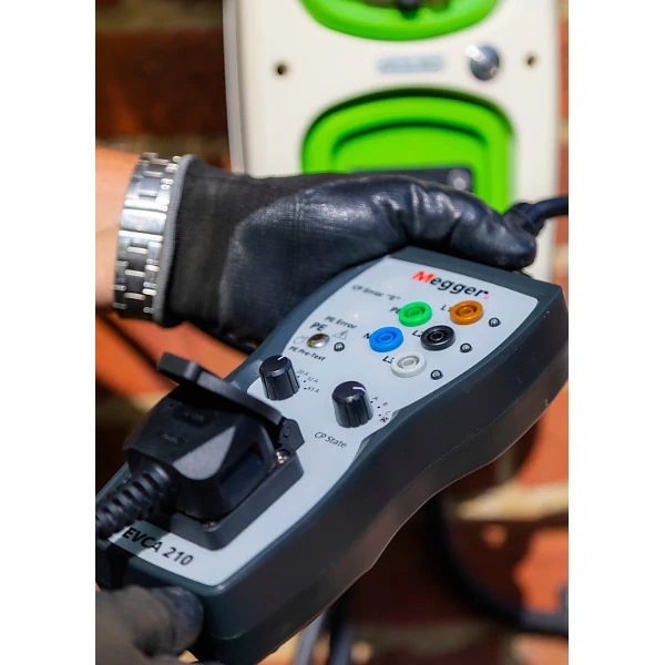 Engineer using the Megger EVCA210-UK EV Charger Tester