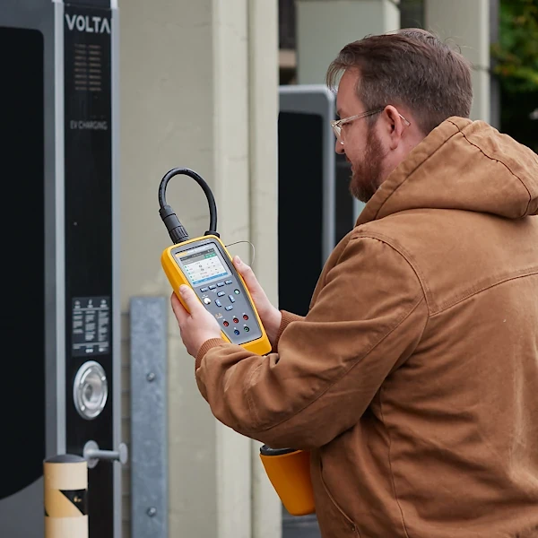 Engineer using the Fluke FEV350 EV Charger Tester