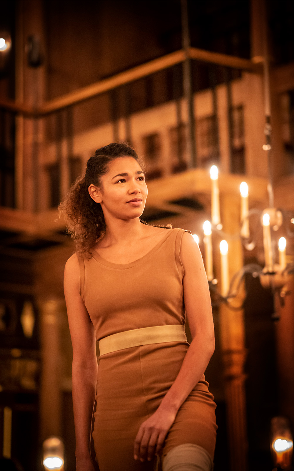 The Taming of the Shrew 2020 An actor on stage in a brown dress