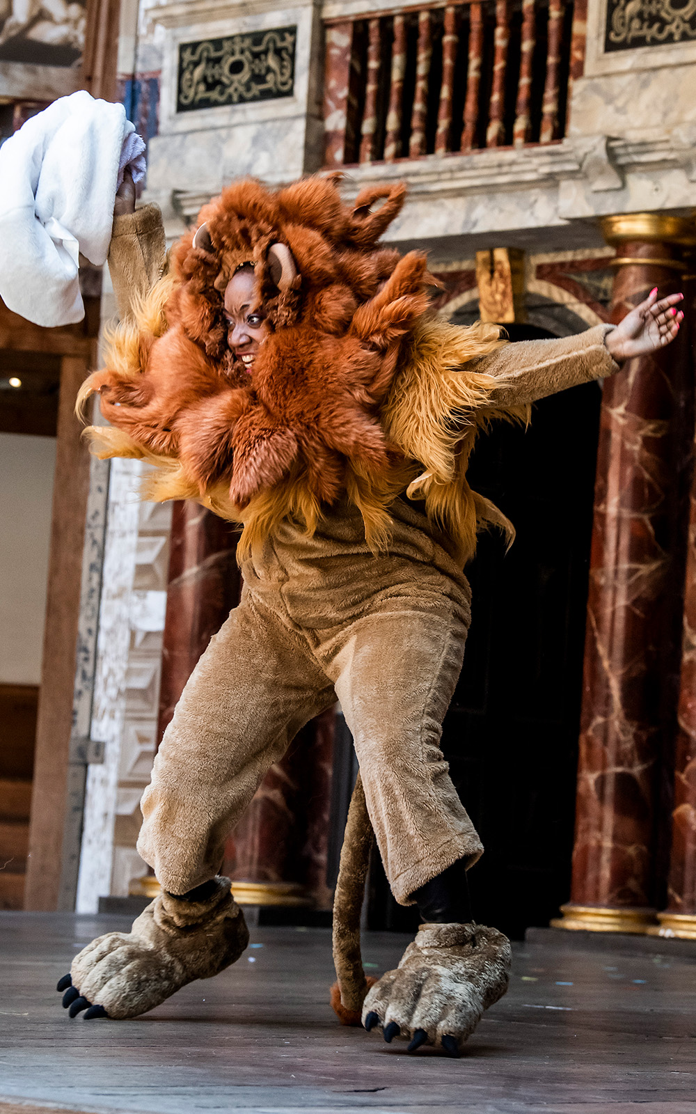 A Midsummer Night’s Dream 2019 A person mid-air in a lion costume