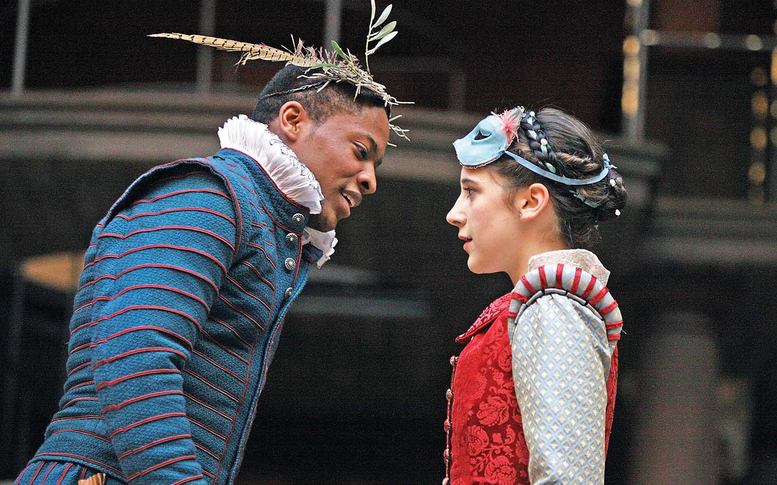 Romeo and Juliet A man and woman stand facing each other on stage