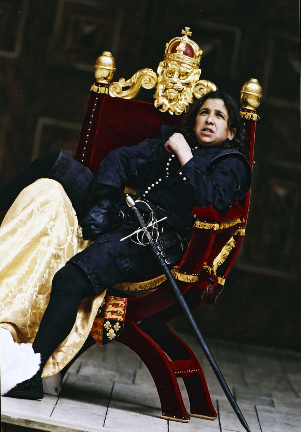 Female cast portrait Kathryn Hunter Richard III Shakespeare's Globe Actor sitting powerfully in a thrown