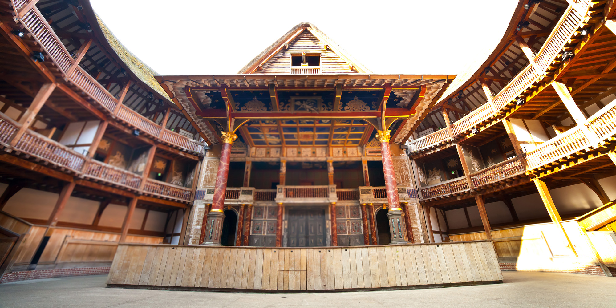 Freelance task force Shakespeare's Globe Interior shot of a wooden circular theatre, looking upwards.